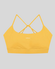 CoreLine Studio Sports Bra in yellow, flatlay front view with scoop neckline