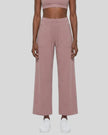 Front view of woman wearing Cameo CoreLine Yoga Pants with a matching color sports bra.