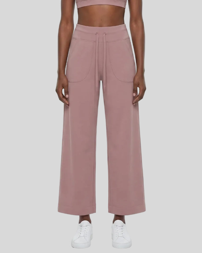 Model wearing CoreLine Yoga Pants in Cameo front view