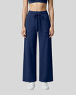 Model wearing CoreLine Yoga Pants in Navy Blue front view