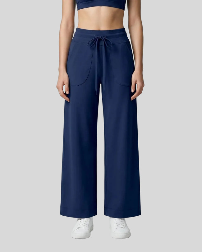 Model wearing CoreLine Yoga Pants in Navy Blue front view