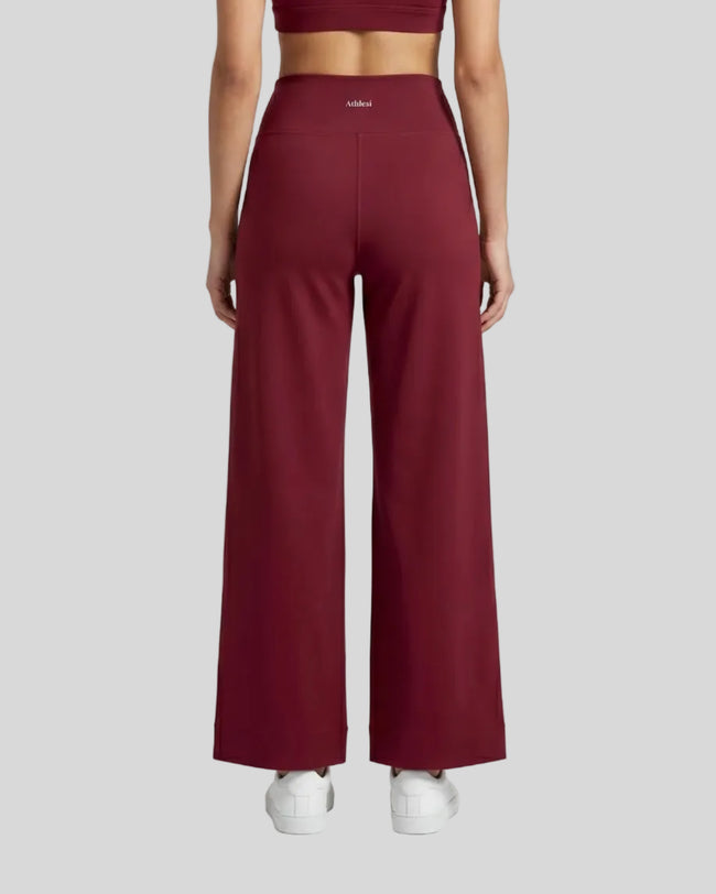 Model wearing CoreLine Yoga Pants in Wine Red back view