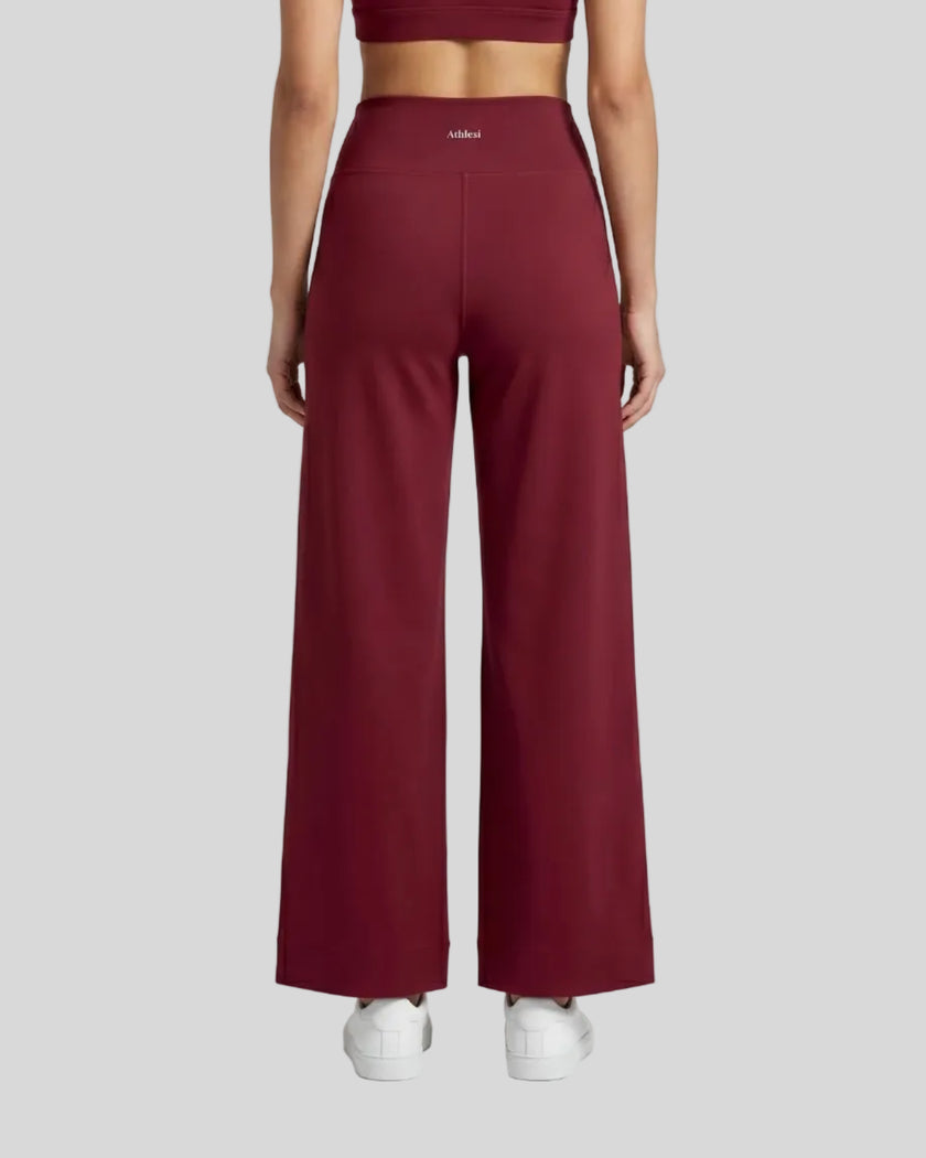 Model wearing CoreLine Yoga Pants in Wine Red back view