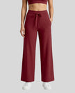 Model wearing CoreLine Yoga Pants in Wine Red front view