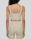 Model wearing CoreLine Yoga Sports Bra in Pale Khaki back view
