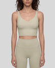 Model wearing CoreLine Yoga Sports Bra in Pale Khaki front view