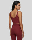 Model wearing CoreLine Yoga Sports Bra in Wine Red back angle view