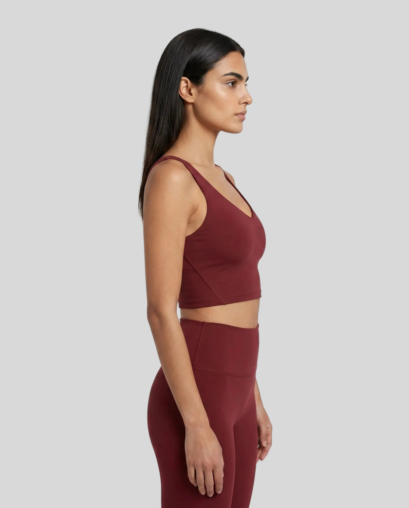 Model wearing CoreLine Yoga Sports Bra in Wine Red side view