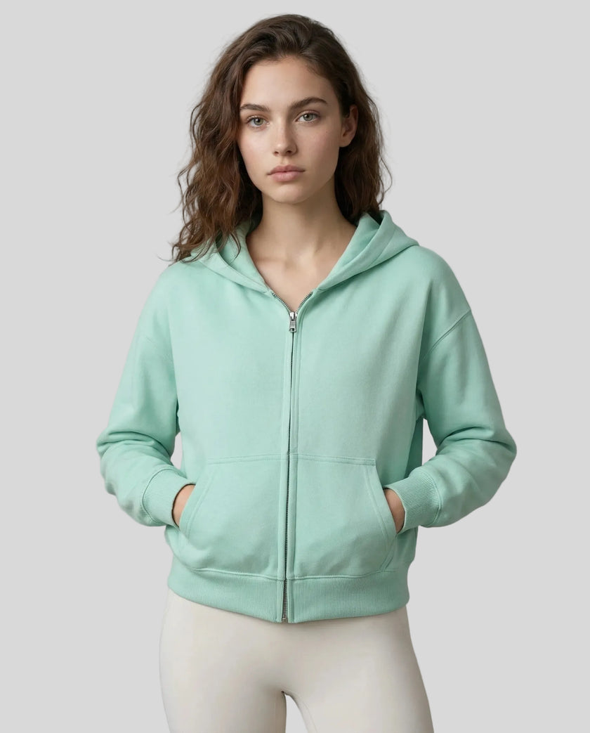 CoreZip Hooded Jacket in light green worn by model mid body front view highlighting fit and structure