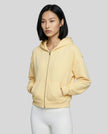 CoreZip Hooded Jacket in yellow worn by model mid body front view highlighting fit and structure