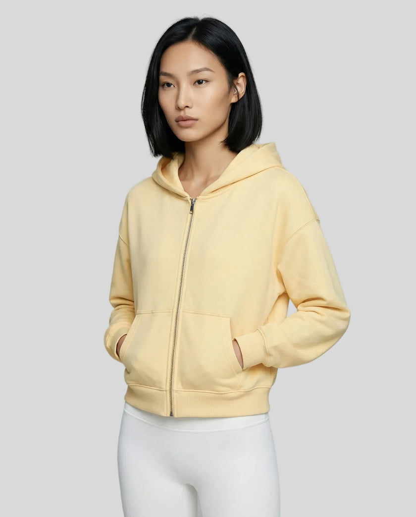 CoreZip Hooded Jacket in yellow worn by model mid body front view highlighting fit and structure