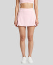 Model wearing the CourtClub A-Line Skirt in Light Pink viewed from the front