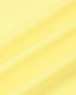 Close-up of the smooth stretch performance fabric used on the CourtClub A-Line Skirt in Yellow.