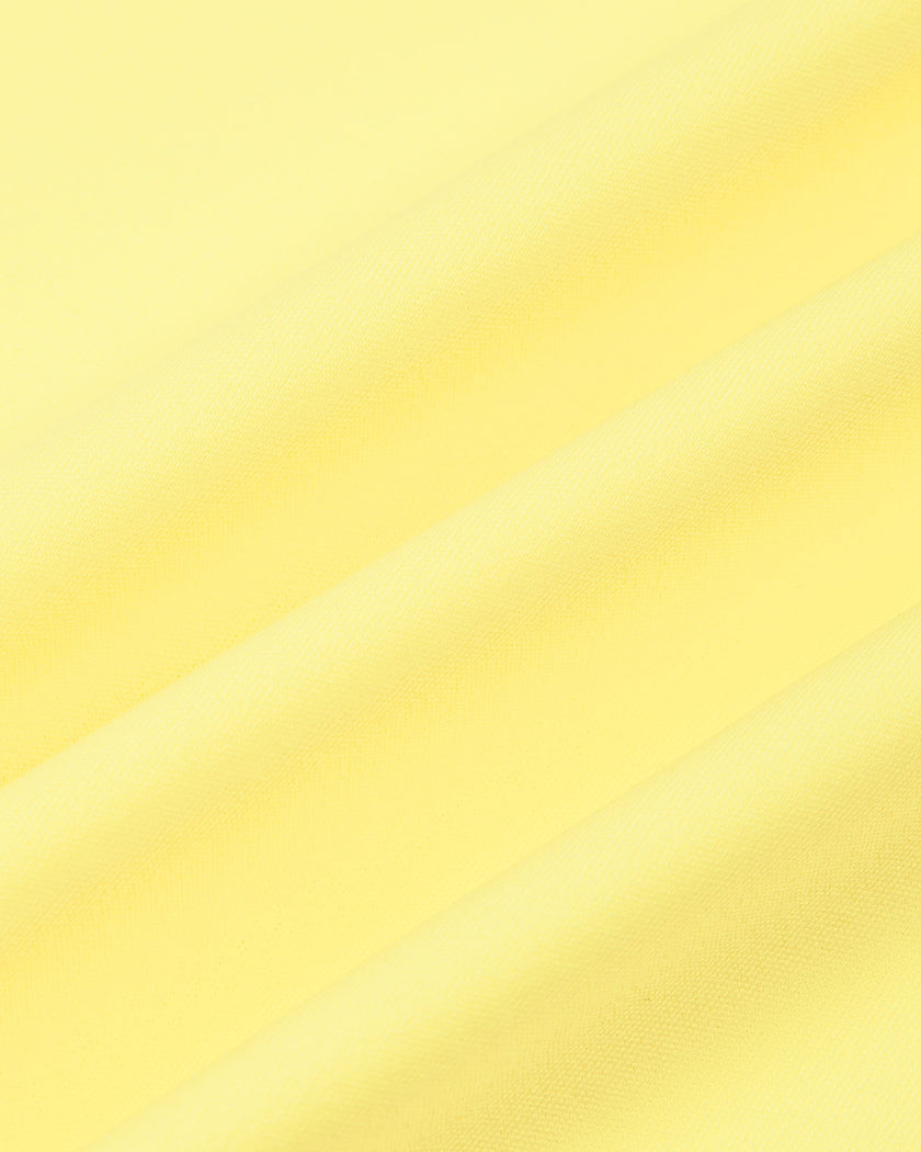 Close-up of the smooth stretch performance fabric used on the CourtClub A-Line Skirt in Yellow.