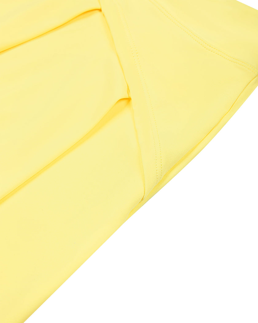 Side angle view of the CourtClub A-Line Skirt in Yellow highlighting its flowing silhouette.