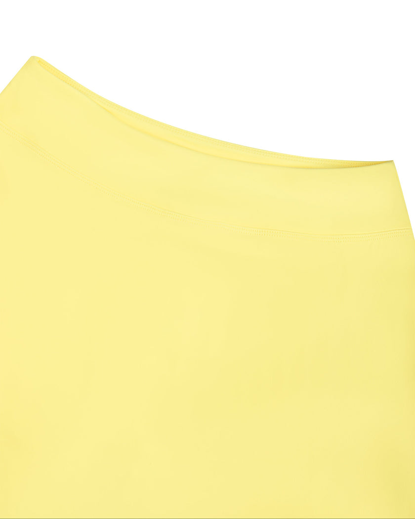 Close-up of the high-rise waistband on the CourtClub A-Line Skirt in Yellow.