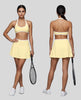 Front and Back view of a model wearing the CourtClub Color Block A-Line Skirt in Light Yellow