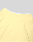 Close-up of the back waistband on the CourtClub Color Block A-Line Skirt in Light Yellow