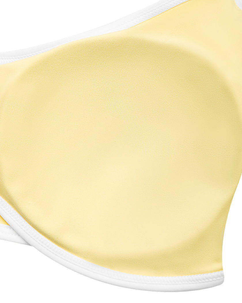 Close-up of the removable chest padding inside the CourtClub Color Block Halter Sports Bra in Light Yellow