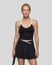 Model wearing the CourtClub Color Block Tank Top in Black, front view