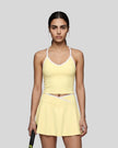 Model wearing the CourtClub Color Block Tank Top in LIght Yellow, front view