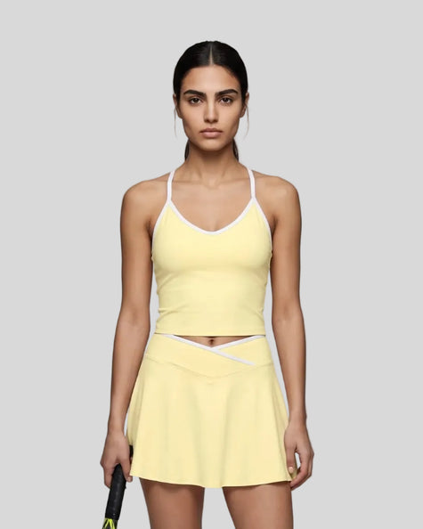 Model wearing the CourtClub Color Block Tank Top in LIght Yellow, front view
