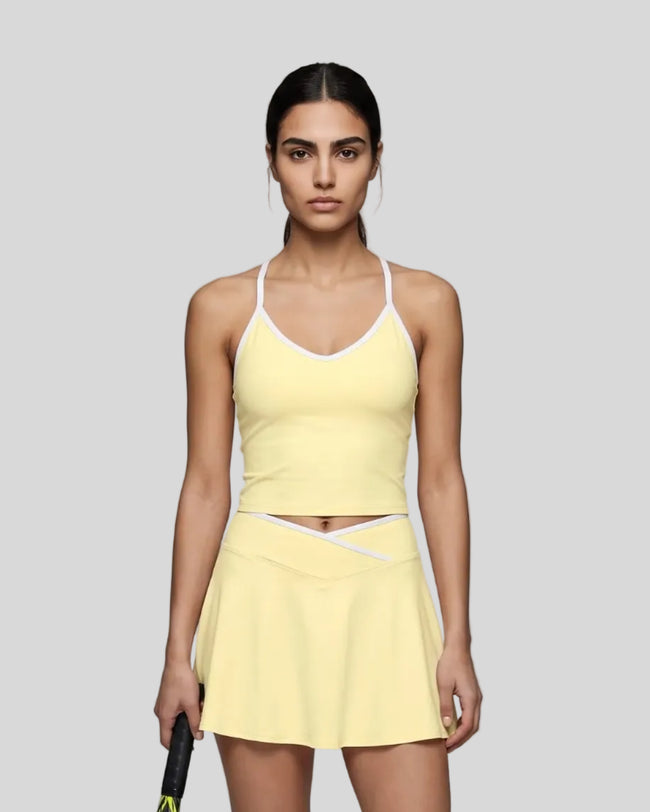 Model wearing the CourtClub Color Block Tank Top in LIght Yellow, front view