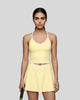 Model wearing the CourtClub Color Block Tank Top in LIght Yellow, front view
