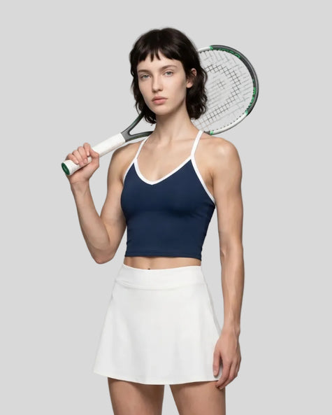 Model wearing the CourtClub Color Block Tank Top in Navy Blue, front view