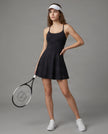 Woman wearing CourtClub Crossback Dress in Black, full-body front view