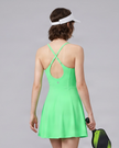 Woman wearing CourtClub Crossback Dress in Green, mid-body back view highlighting the fitted bodice