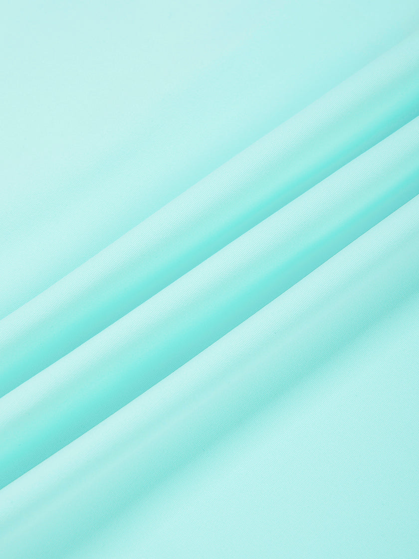 Close-up of smooth stretch fabric on CourtClub Crossback Dress in Sky Blue