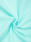 Detailed view of lightweight stretch knit fabric on CourtClub Crossback Dress in Sky Blue
