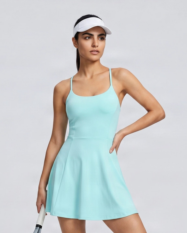 Woman wearing CourtClub Crossback Dress in Sky Blue, mid-body front view highlighting the fitted bodice
