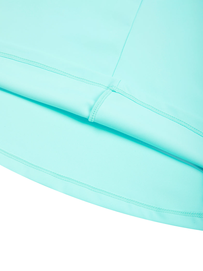 Close-up of flared skirt hem on CourtClub Crossback Dress in Sky Blue