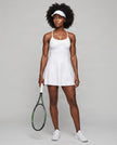 Woman wearing CourtClub Crossback Dress in White, full-body front view