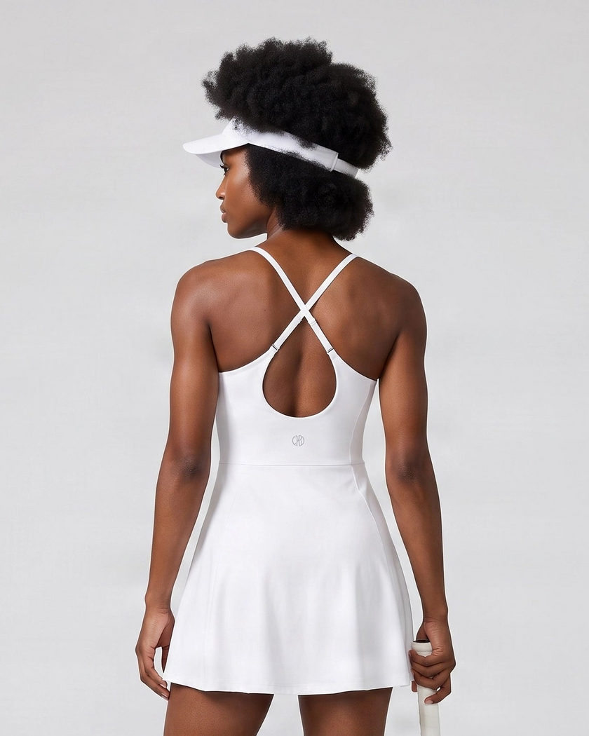 Woman wearing CourtClub Crossback Dress in White, mid-body back view highlighting the fitted bodice