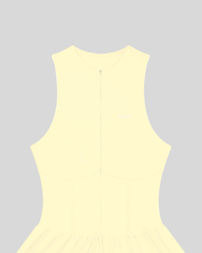 A light yellow CourtClub Full-Zip Dress with a small white 'Athlesi' logo on the upper left chest