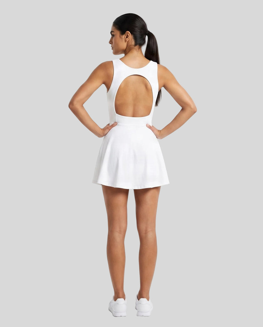 Woman wearing Athlesi CourtClub Open-Back Tennis Dress in White full-body back view showing open-back design