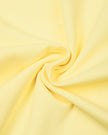 Athlesi CourtClub Open-Back Tennis Dress in Yellow detailed view of moderate-weight stretch fabric texture