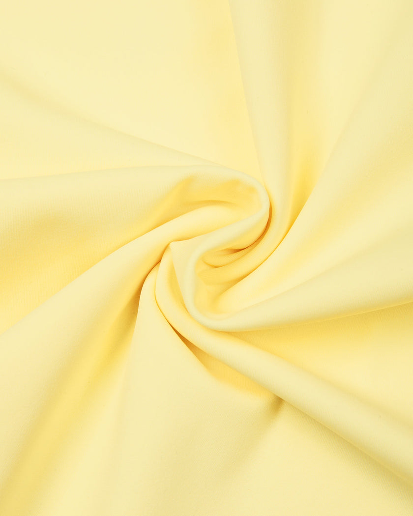 Athlesi CourtClub Open-Back Tennis Dress in Yellow detailed view of moderate-weight stretch fabric texture