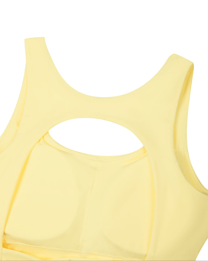 Athlesi CourtClub Open-Back Tennis Dress in Yellow closeup showing large rounded open-back detail