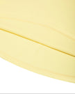 Athlesi CourtClub Open-Back Tennis Dress in Yellow closeup of flared skirt and finished hem