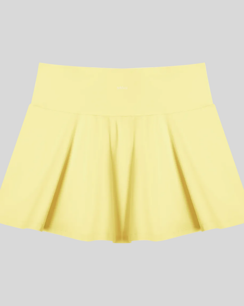 CourtClub Pleated Skirt in Yellow back view showcasing its flowing pleated design