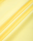 Close-up of the smooth stretch performance fabric used on the CourtClub Pleated Skirt in Yellow