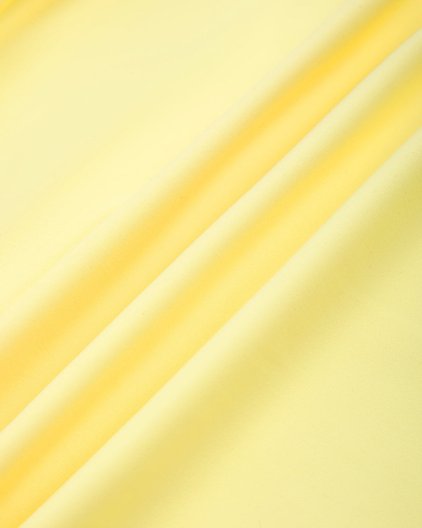 Close-up of the smooth stretch performance fabric used on the CourtClub Pleated Skirt in Yellow