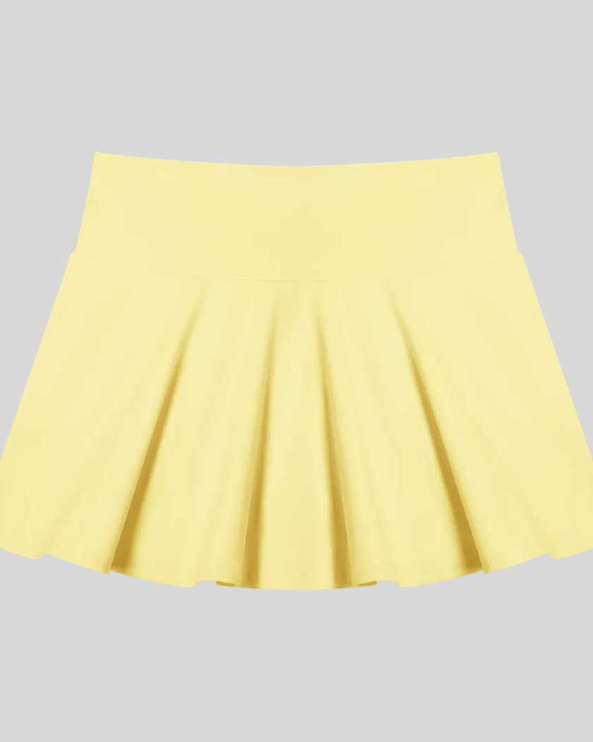 CourtClub Pleated Skirt in Yellow front view featuring a flattering high-rise waistband and elegant pleated silhouette