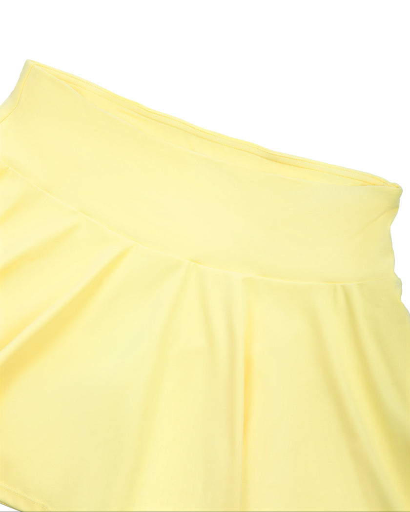 Close-up of the high-rise waistband on the CourtClub Pleated Skirt in Yellow