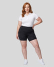 Woman wearing Athlesi CourtClub Tennis Short in Black full-body front view