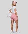 Woman wearing Athlesi CourtClub Tennis Short in Pink full-body back view showing high-rise fit
